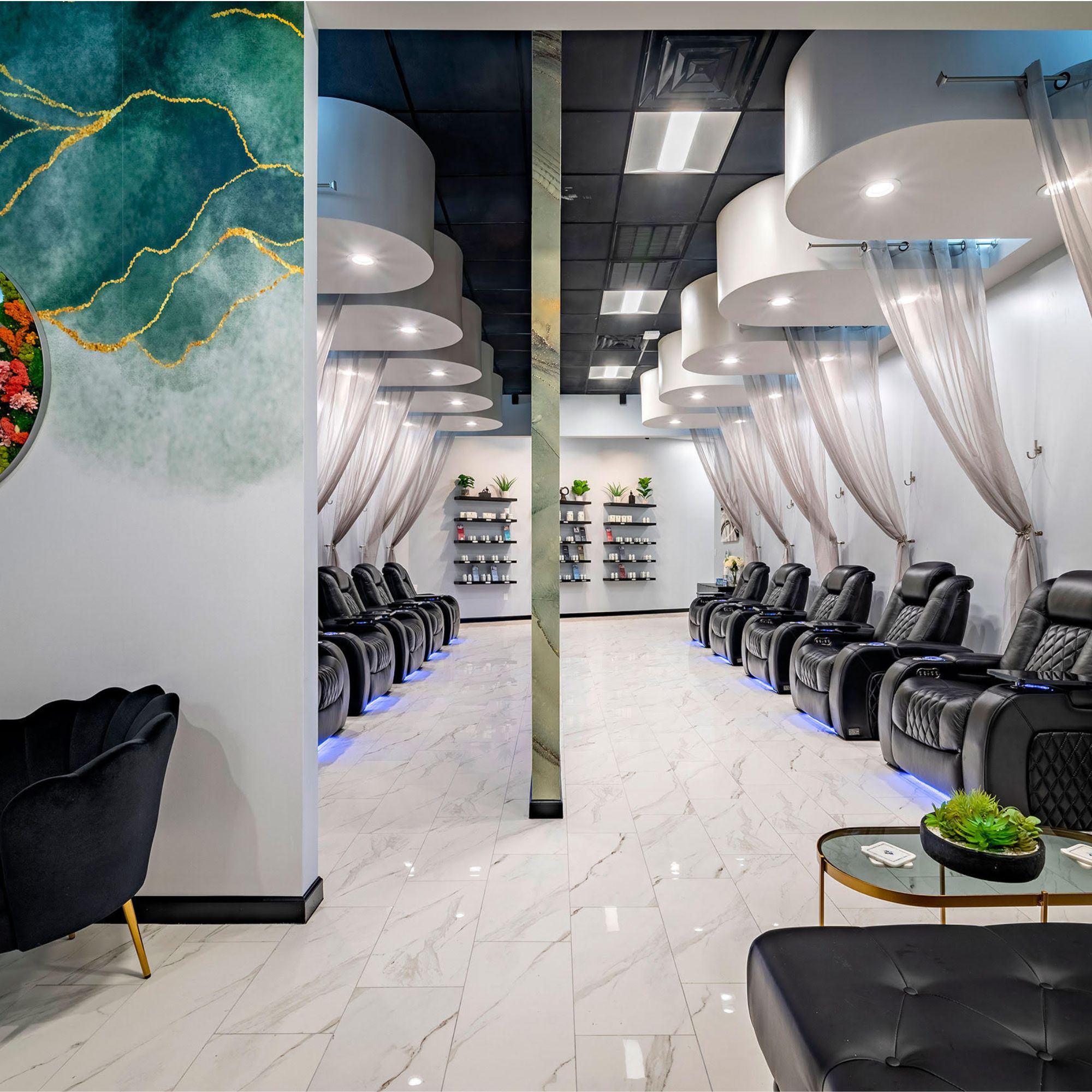 A room with chairs and a wall with a mirror offering nutritional IV therapy and drip hydration.