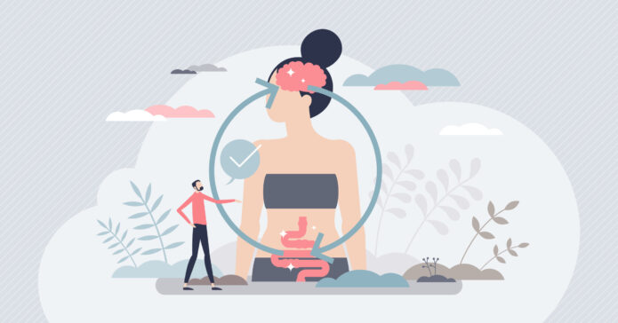Illustration of a small person pointing to a large female figure with brain and digestive system diagrams inside circle arrows, representing the connection between mental and gut health.